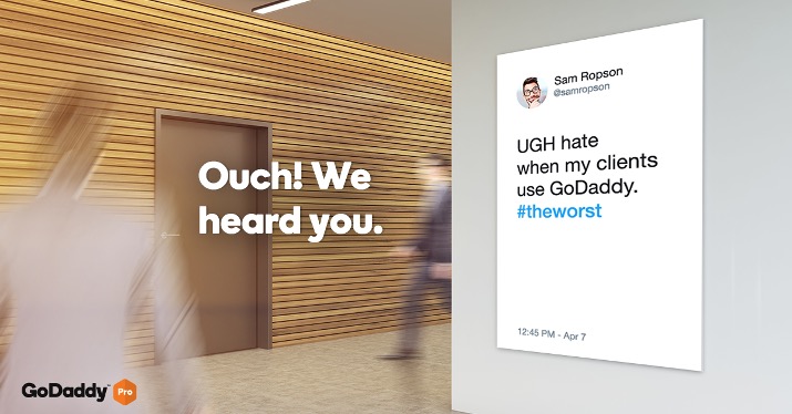 GoDaddy ad featuring real customer tweet criticizing the brand alongside the message “Ouch! We heard you.”